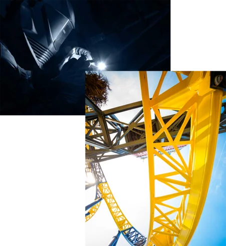 Un employé des productions MACK Rides équipé d’un casque de sécurité, et le rail jaune d'un grand huit MACK Rides.