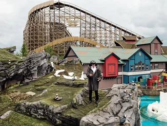 Michael Mack wearing a VR headset and hand trackers in the Scandinavian themed area of Europa-Park.