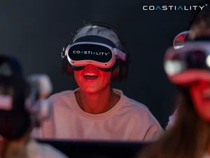 Passenger wearing the Coastiality VR headset.