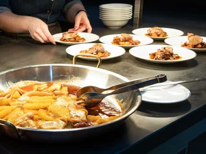 Fine dishes are served directly in the kitchen of the hotel restaurant.