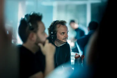 Michael Mack at work with a headset and focused gaze.