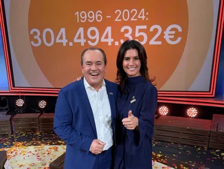 RTL-Spendenmarathon Wolfram Kons und Miriam Mack (von links) stehen gemeinsam vor einer großen Anzeige mit den, im Rahmen des RTL-Spendenmarathons von 1996 bis 2024, gespendeten 304.494.352 €.