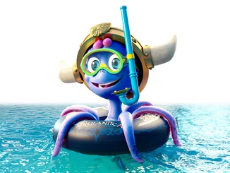 Snorri in a swimming ring and with a snorkel set.