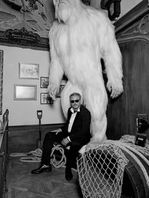 Michael Mack in front of a giant yeti sculpture in the waiting area of the Voletarium attraction at Europa-Park.