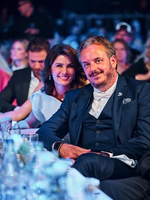 Michael Mack next to his wife Miriam at a table at the Europa-Park 50th anniversary gala.