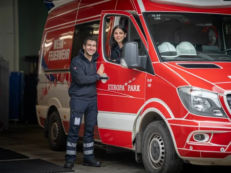 Two members of the Europa-Park fire brigade in their emergency vehicle.