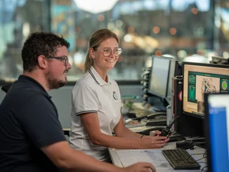 Two employees of the Rulantica water world at work in the office.