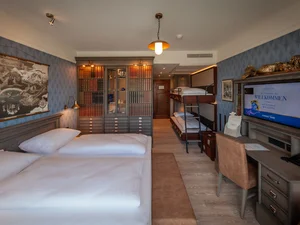 The Standard Quadruple Room Plus at hotel 'Krønasår', with its unique Nordic theme and attention to detail.