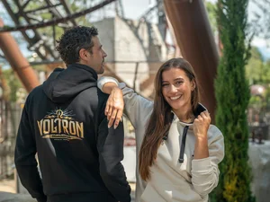Couple wearing the stylish Voltron Nevera hoodie during their visit to Europa-Park.
