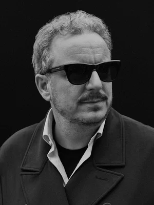 Black and white portrait of Michael Mack wearing sunglasses.