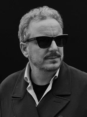 Black and white portrait of Michael Mack wearing sunglasses.