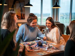 A group of friends plays the 50 years of Europa-Park Monopoly game.