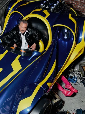 Michael Mack sits in a racing car in the waiting area of the GRAND PRIX EDventure attraction.