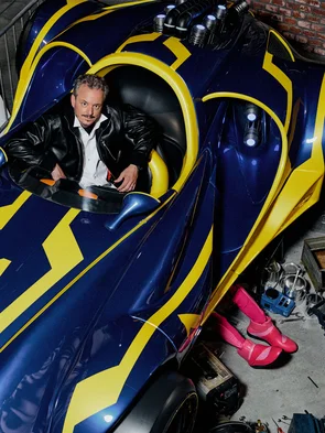 Michael Mack sits in a racing car in the waiting area of the GRAND PRIX EDventure attraction.