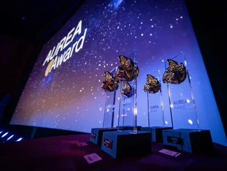 AUREA Award 2025 trophies on display.