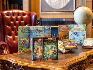 Various books from the Europa-Park Resort are on a table.