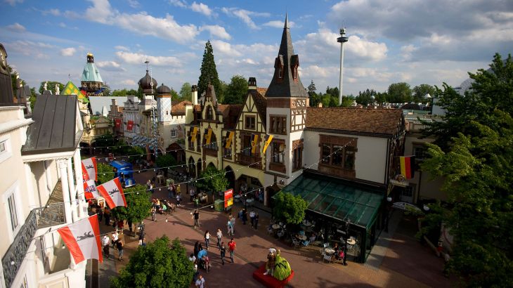 A bird's-eye view of Deutsche Allee, bustling with visitors, in the German themed area of Europa-Park.