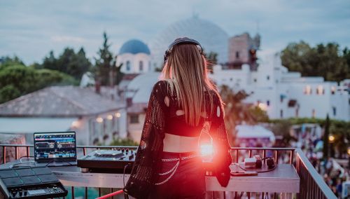 A female DJ is performing at an open-air party at the Europa-Park Resort.